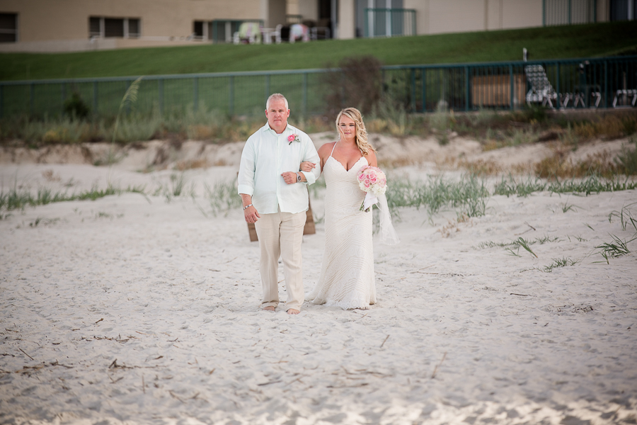 Father and bride walking down beach at this Daytona Beach Wedding by Destination Wedding Photographer, Amanda May Photos.