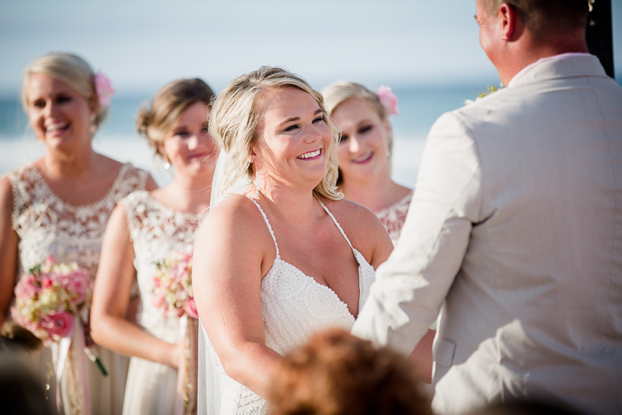 Brides smile looking at groom at this Daytona Beach Wedding by Destination Wedding Photographer, Amanda May Photos.