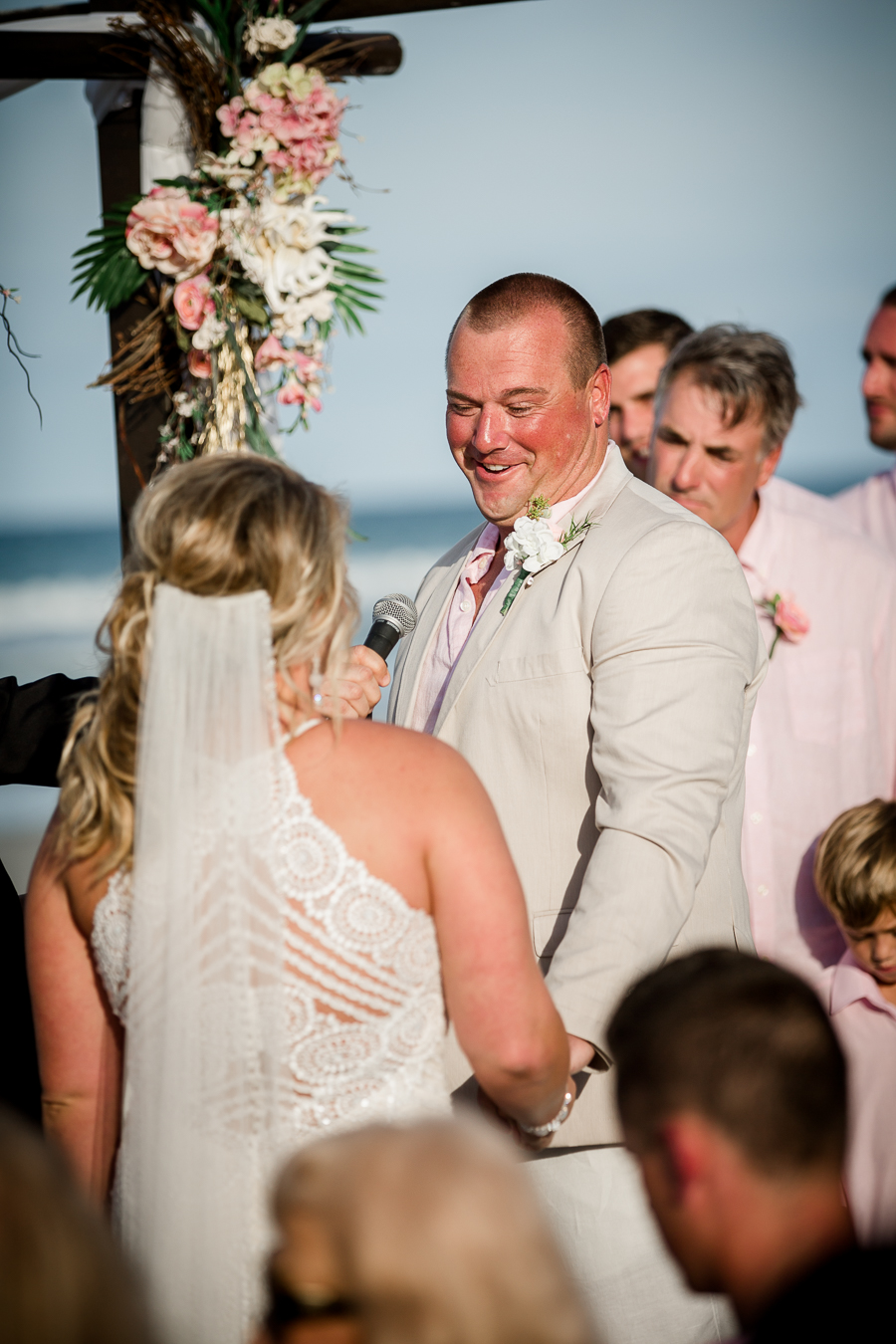 Groom smiling at bride at this Daytona Beach Wedding by Destination Wedding Photographer, Amanda May Photos.