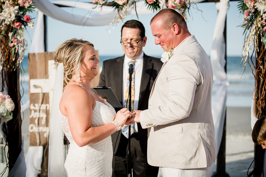 Bride and Groom smiling at each other at this Daytona Beach Wedding by Destination Wedding Photographer, Amanda May Photos.