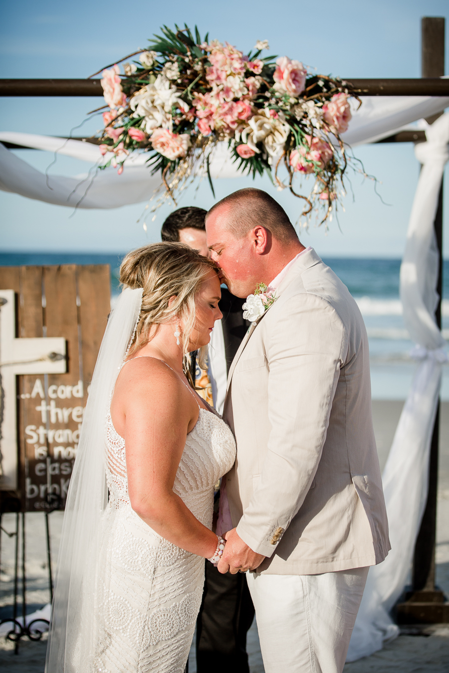 Groom kissing brides forehead at this Daytona Beach Wedding by Destination Wedding Photographer, Amanda May Photos.