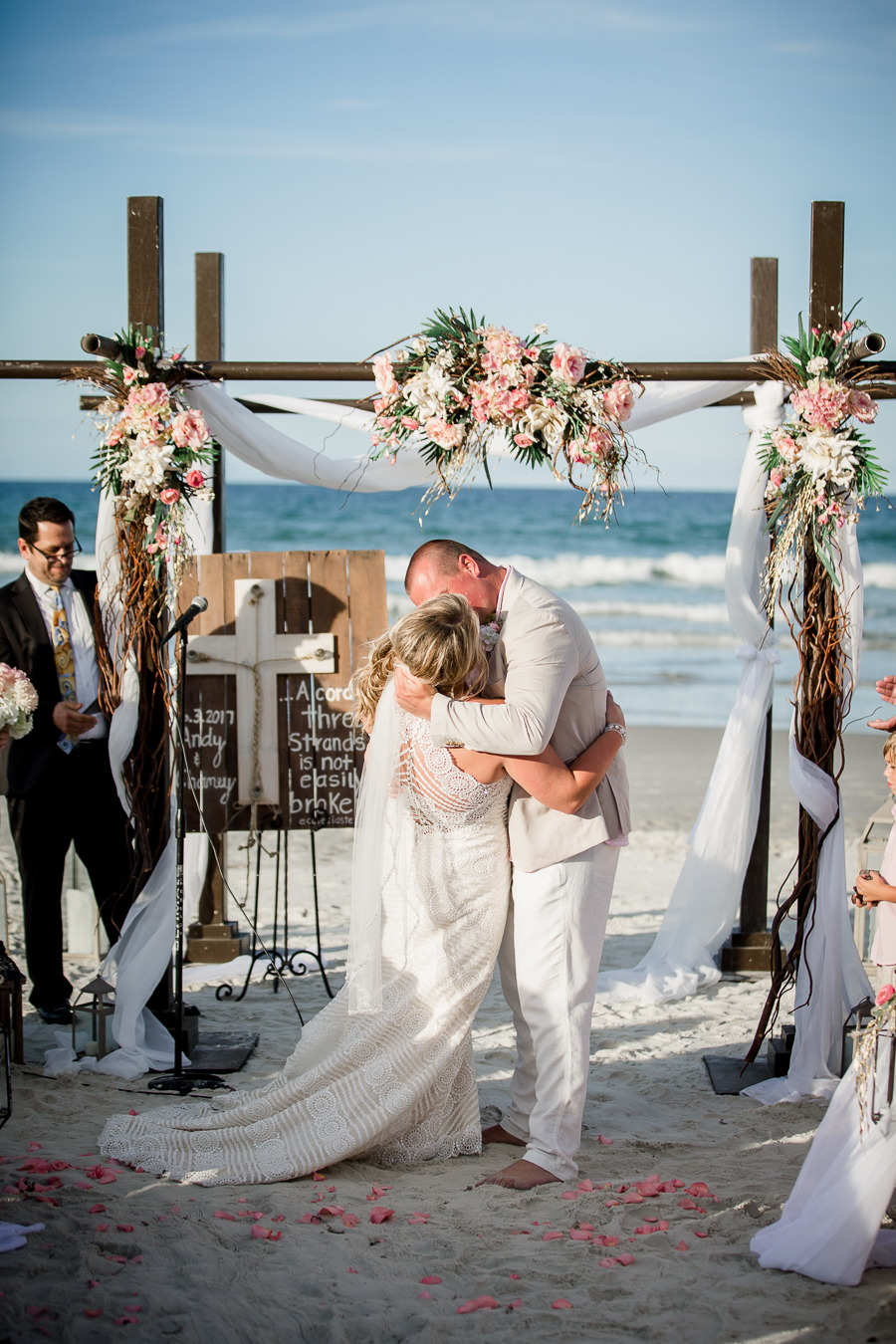 Kissing at alter at this Daytona Beach Wedding by Destination Wedding Photographer, Amanda May Photos.