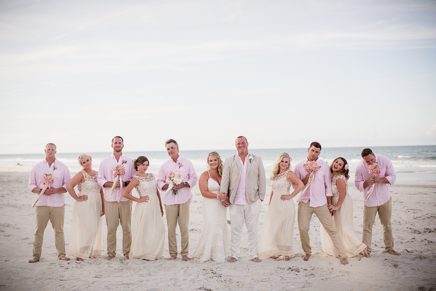 Silly photo of bridal party on beach at this Daytona Beach Wedding by Destination Wedding Photographer, Amanda May Photos.