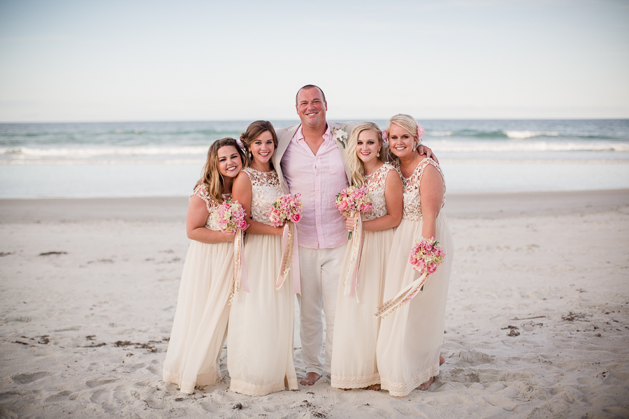 Bridesmaids with Groom at this Daytona Beach Wedding by Destination Wedding Photographer, Amanda May Photos.