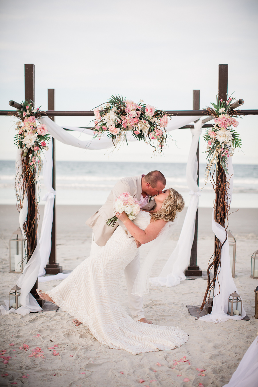 Bride and Groom kissing until alter at this Daytona Beach Wedding by Destination Wedding Photographer, Amanda May Photos.