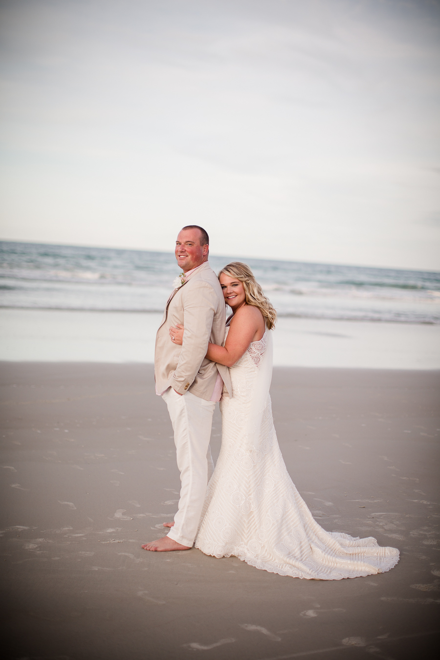 Hugging Groom from behind at this Daytona Beach Wedding by Destination Wedding Photographer, Amanda May Photos.