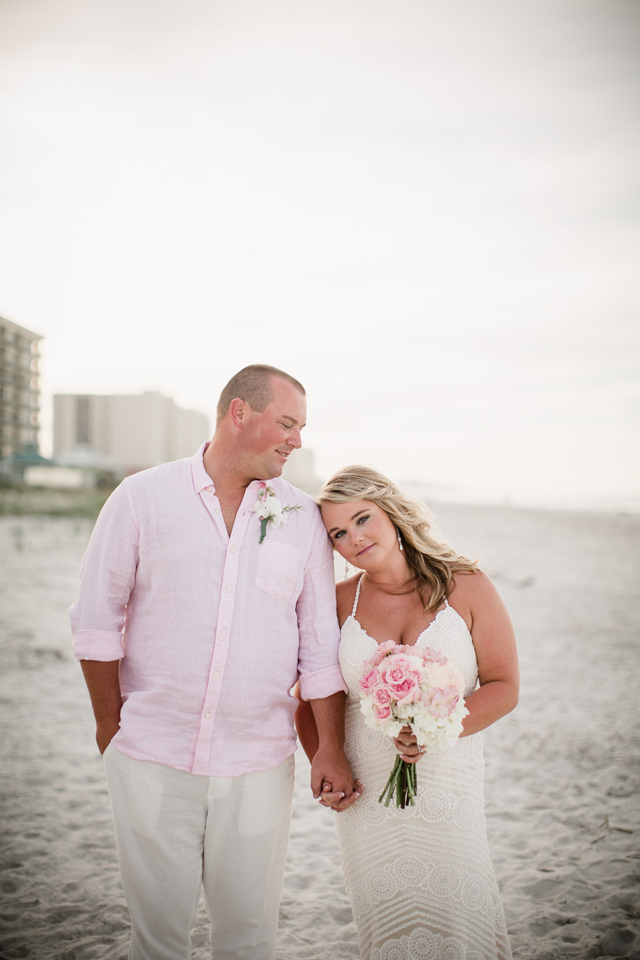 Bride with head on grooms shoulder at this Daytona Beach Wedding by Destination Wedding Photographer, Amanda May Photos.