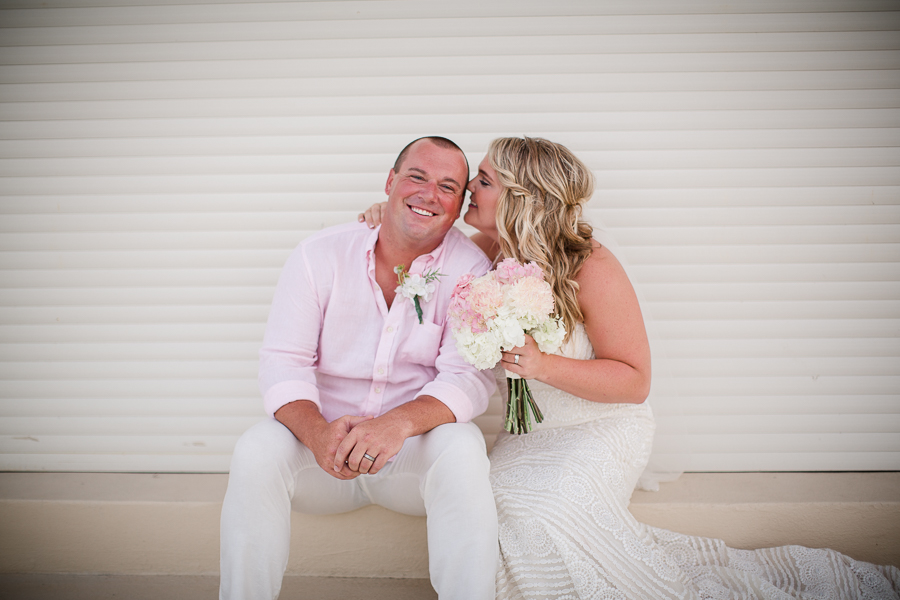 Bride whispering in Grooms ear at this Daytona Beach Wedding by Destination Wedding Photographer, Amanda May Photos.