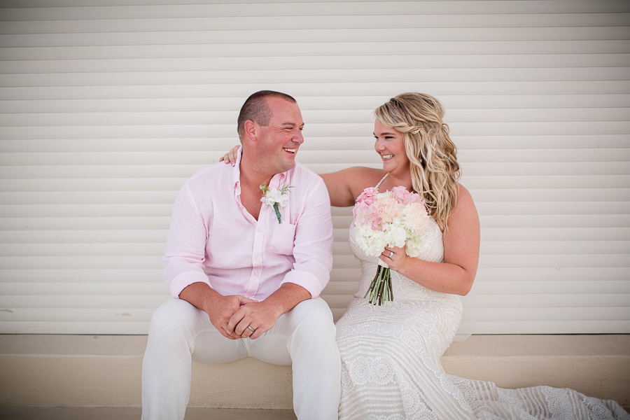 Bride laughing at Groom at this Daytona Beach Wedding by Destination Wedding Photographer, Amanda May Photos.