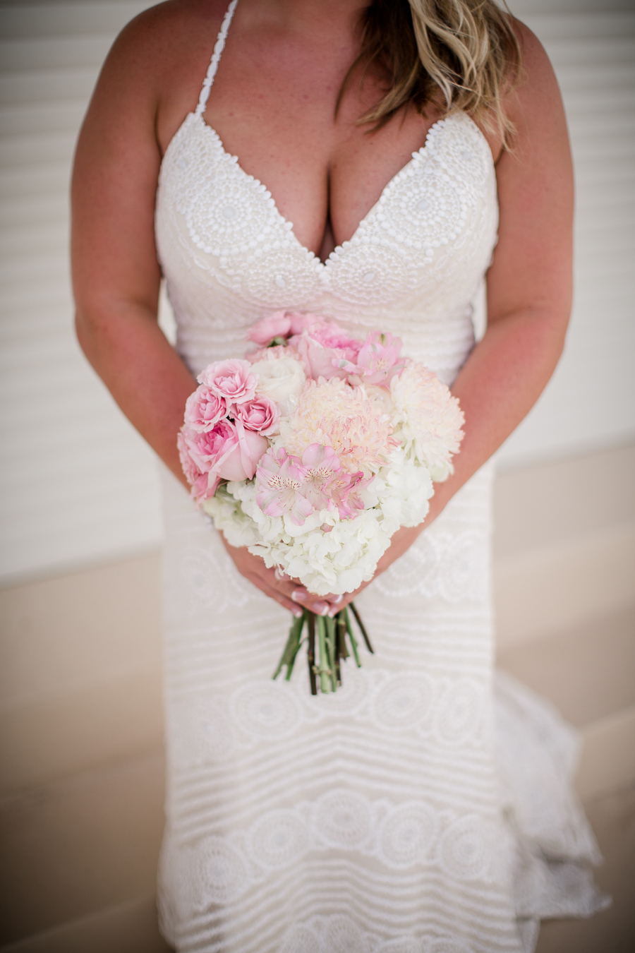 Flower arrangement with dress at this Daytona Beach Wedding by Destination Wedding Photographer, Amanda May Photos.