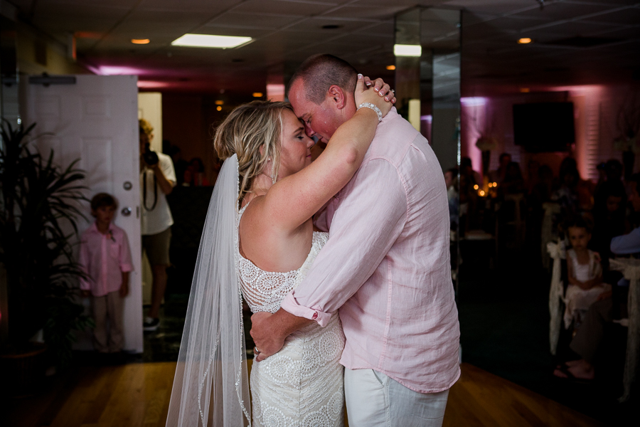 Arms around each other dancing at this Daytona Beach Wedding by Destination Wedding Photographer, Amanda May Photos.