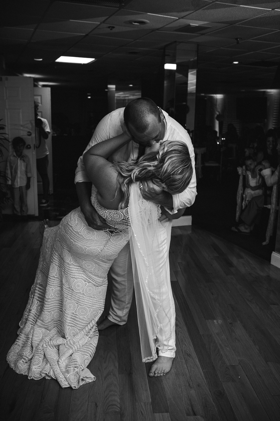 Black and white of dancing kissing at this Daytona Beach Wedding by Destination Wedding Photographer, Amanda May Photos.