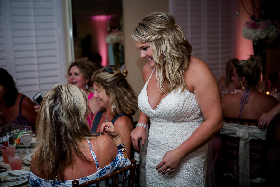 Bride interacting with guests at this Daytona Beach Wedding by Destination Wedding Photographer, Amanda May Photos.