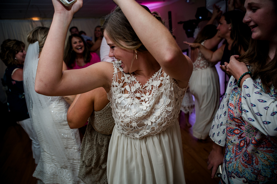 Bridesmaid dancing at this Daytona Beach Wedding by Destination Wedding Photographer, Amanda May Photos.