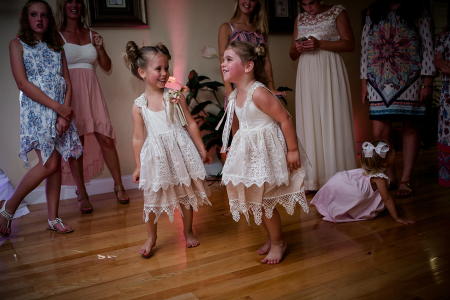 Flower girls dancing at this Daytona Beach Wedding by Destination Wedding Photographer, Amanda May Photos.