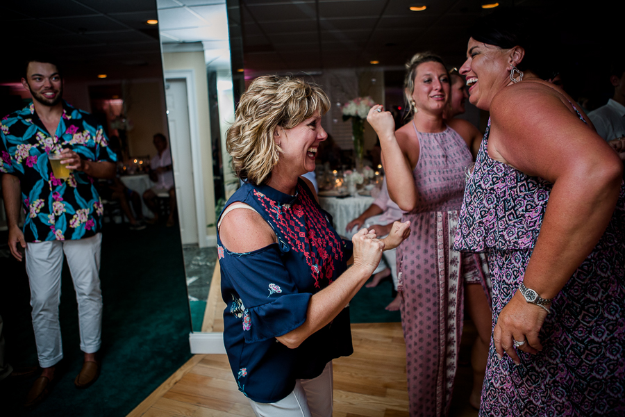 Smiling and dancing at this Daytona Beach Wedding by Destination Wedding Photographer, Amanda May Photos.