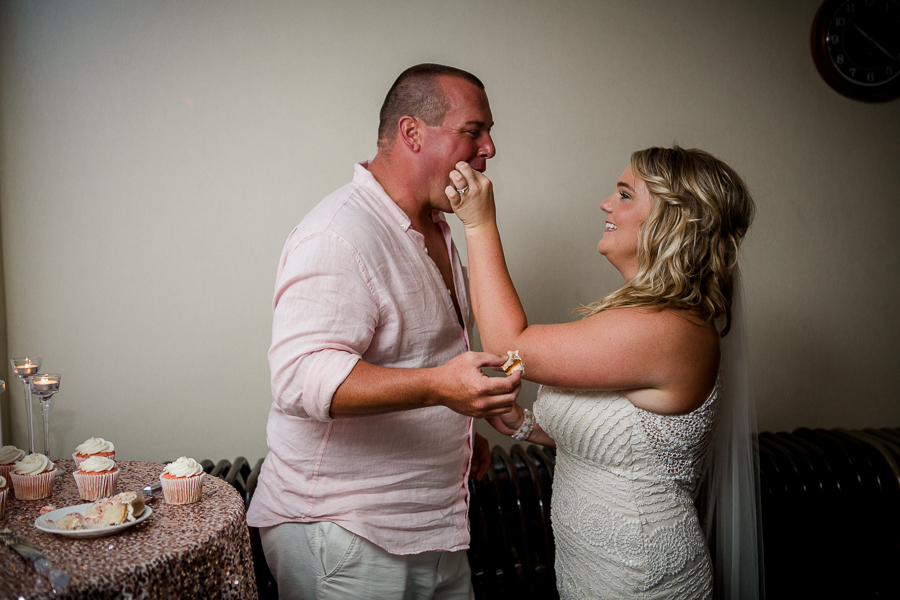 Eating cake at this Daytona Beach Wedding by Destination Wedding Photographer, Amanda May Photos.
