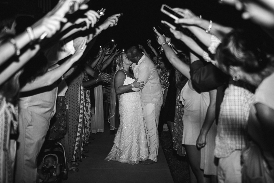 Kissing in sparkler send off at this Daytona Beach Wedding by Destination Wedding Photographer, Amanda May Photos.