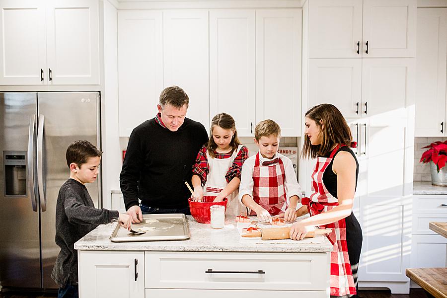 Buffalo plaid aprons at this Christmas cookie session by Knoxville Wedding Photographer, Amanda May Photos.