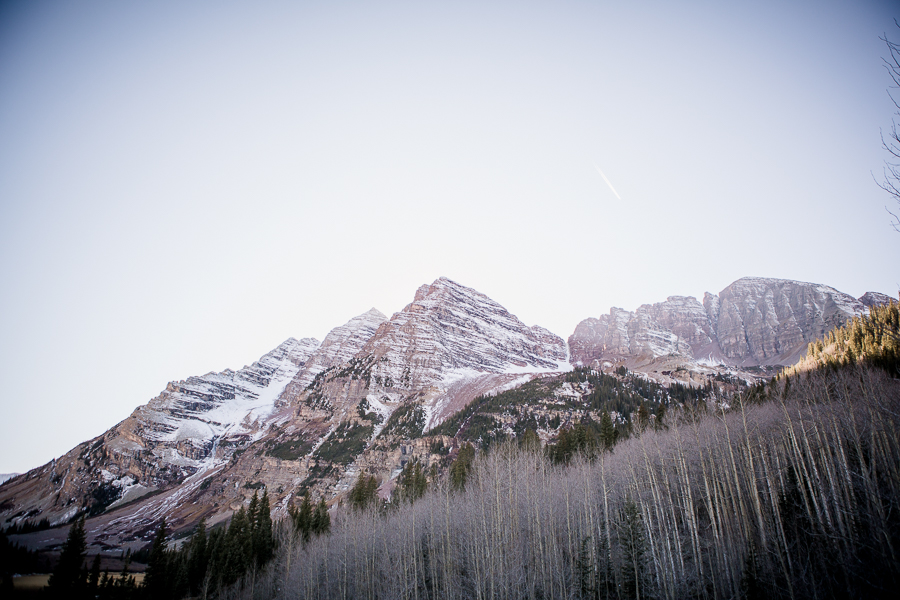 Sun coming up behind snowy mountain in Aspen by Knoxville Wedding Photographer, Amanda May Photos.
