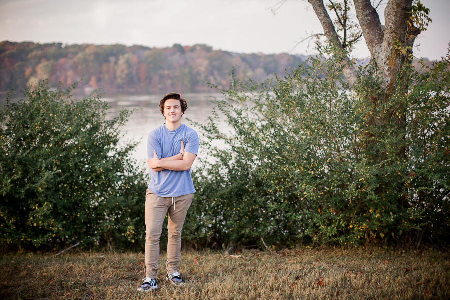Arms crossed with the lake in the background at this Maryville, TN Senior session by Knoxville Wedding Photographer, Amanda May Photos.