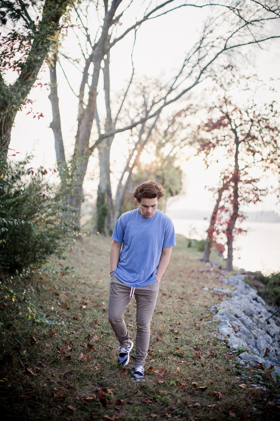 Walking towards camera with sunset at this Maryville, TN Senior session by Knoxville Wedding Photographer, Amanda May Photos.