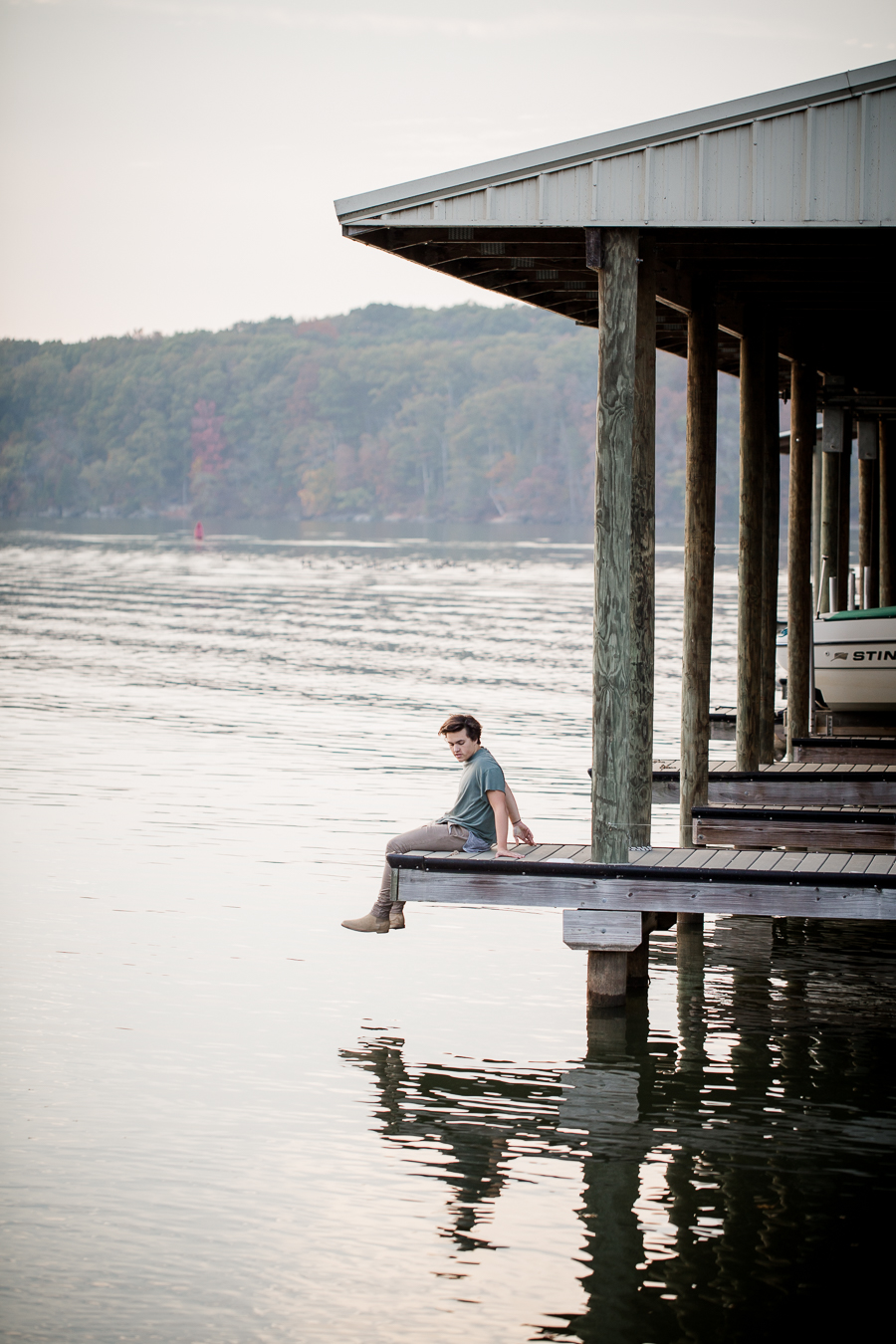 Sitting on the dock at this Maryville, TN Senior session by Knoxville Wedding Photographer, Amanda May Photos.
