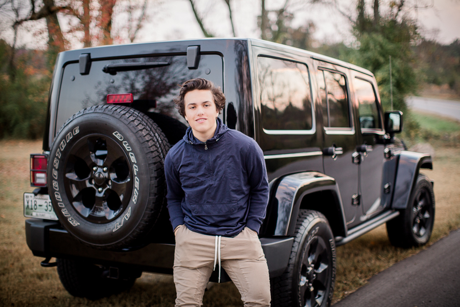 Leaning against his black jeep at this Maryville, TN Senior session by Knoxville Wedding Photographer, Amanda May Photos.
