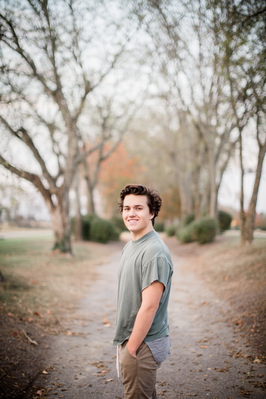 Looking back over his shoulder at this Maryville, TN Senior session by Knoxville Wedding Photographer, Amanda May Photos.