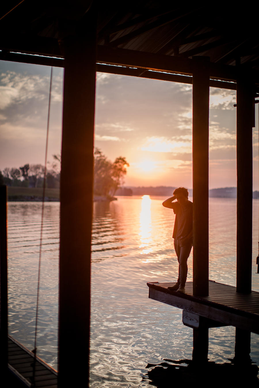 Silhouette against a sunset at this Maryville, TN Senior session by Knoxville Wedding Photographer, Amanda May Photos.