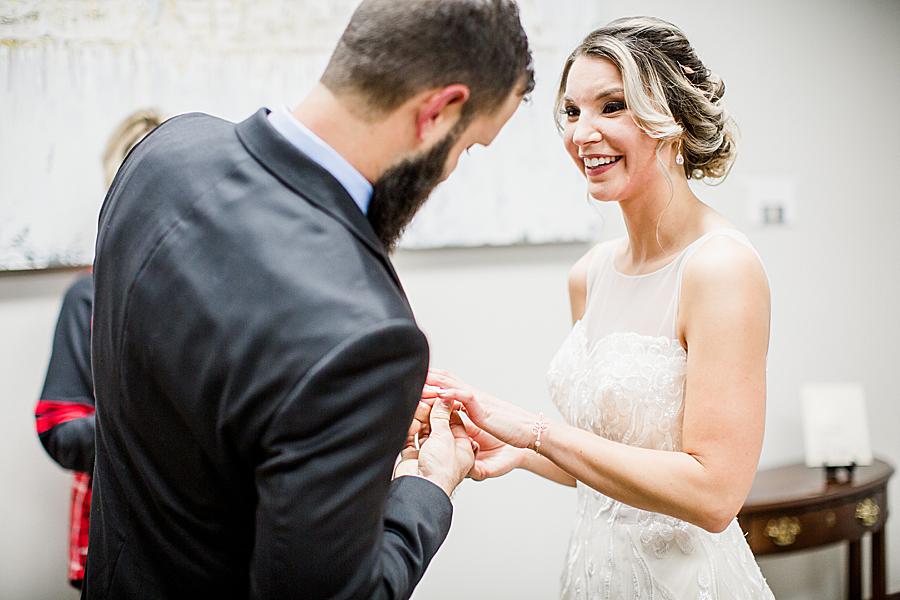 Exchanging rings at their courthouse wedding
