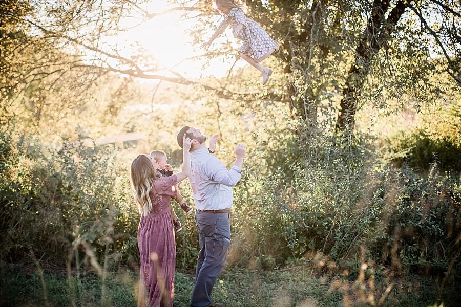 Tossing his daughter at this Melton Hill Park Family Session by Knoxville Wedding Photographer, Amanda May Photos.