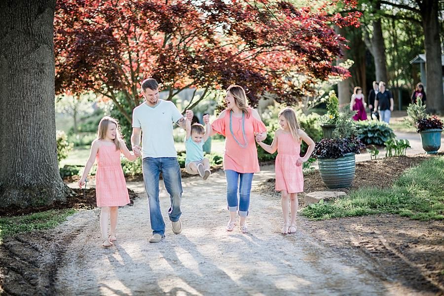 Swinging the son at this UT Gardens Engagement by Knoxville Wedding Photographer, Amanda May Photos.