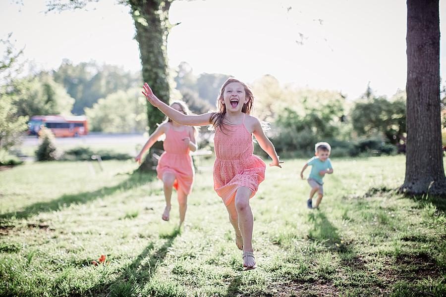 Kids running at this UT Gardens Engagement by Knoxville Wedding Photographer, Amanda May Photos.