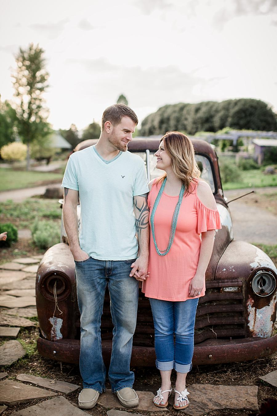 Looking at each other at this UT Gardens Engagement by Knoxville Wedding Photographer, Amanda May Photos.