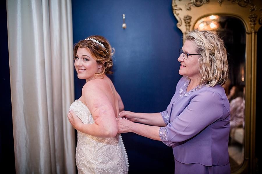 Buttoning the dress at this Hunter Valley Pavilion Wedding by Knoxville Wedding Photographer, Amanda May Photos.