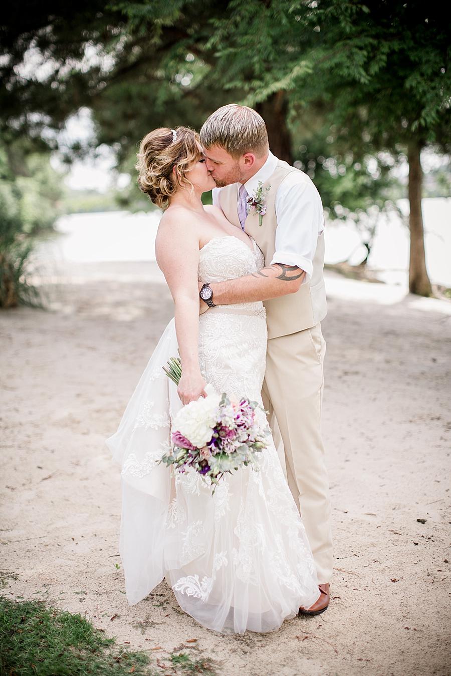 Kissing on the beach at this Hunter Valley Pavilion Wedding by Knoxville Wedding Photographer, Amanda May Photos.