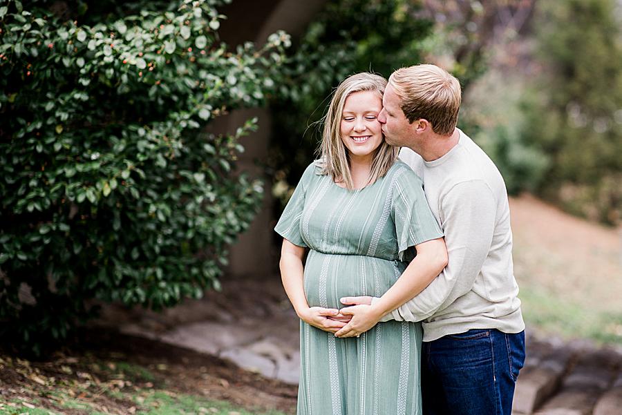 Kiss on the cheek at this Downtown Knoxville Maternity by Knoxville Wedding Photographer, Amanda May Photos.