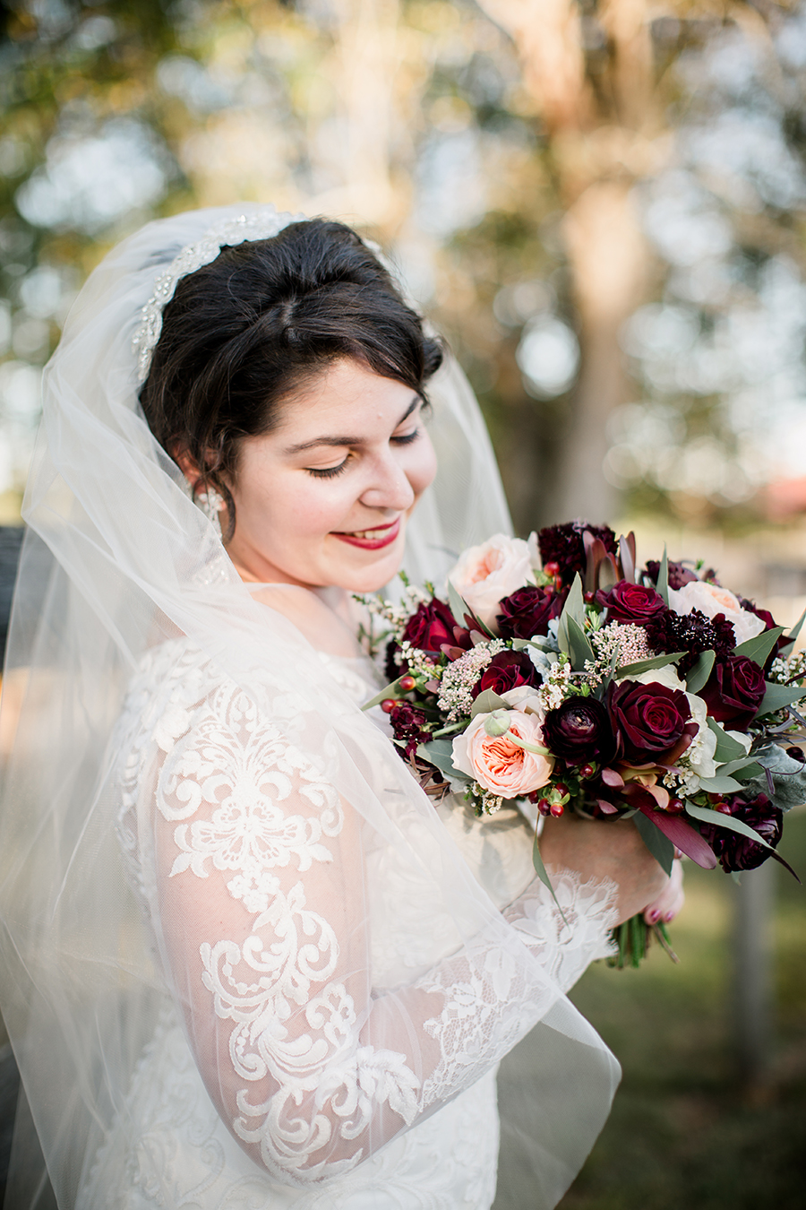 Flowers close to her face at this bridal session at The Barn at High Point Farms by Knoxville Wedding Photographer, Amanda May Photos.