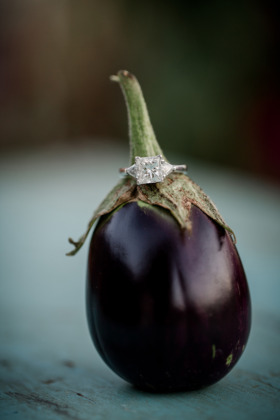 Engagement ring sitting on a tiny eggplant at this bridal session at The Barn at High Point Farms by Knoxville Wedding Photographer, Amanda May Photos.