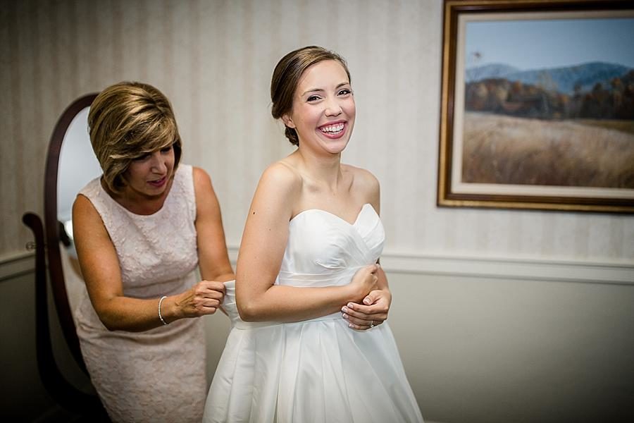 Zipping up the dress at this Fountain City Church Wedding by Knoxville Wedding Photographer, Amanda May Photos.