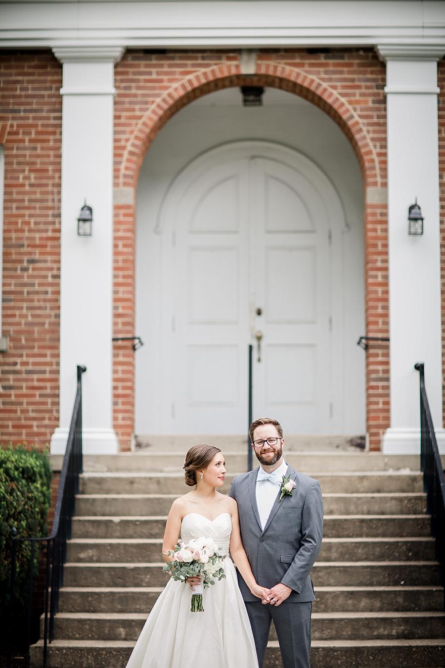 At the bottom of the steps at this Fountain City Church Wedding by Knoxville Wedding Photographer, Amanda May Photos.