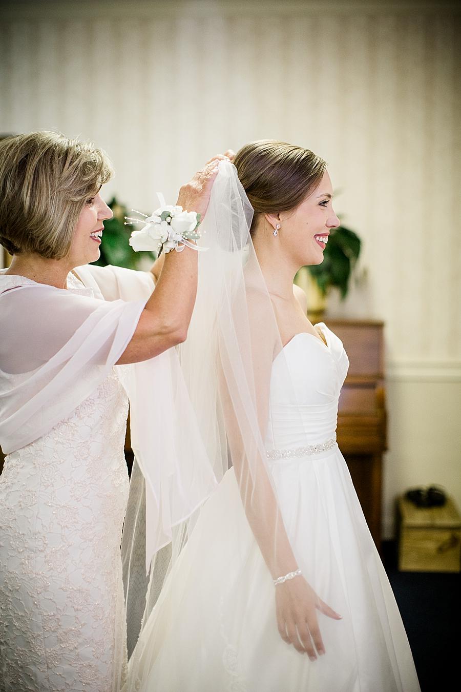 Putting on the veil at this Fountain City Church Wedding by Knoxville Wedding Photographer, Amanda May Photos.