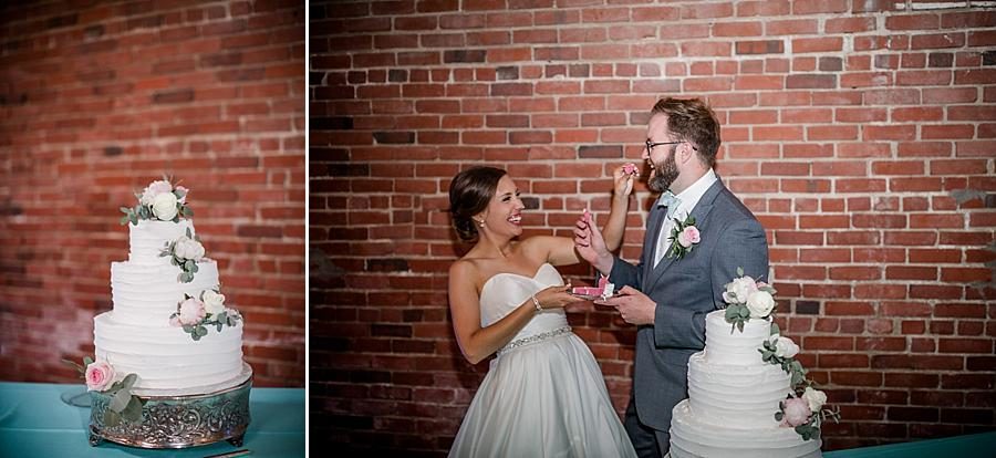 Cutting the cake at this Fountain City Church Wedding by Knoxville Wedding Photographer, Amanda May Photos.