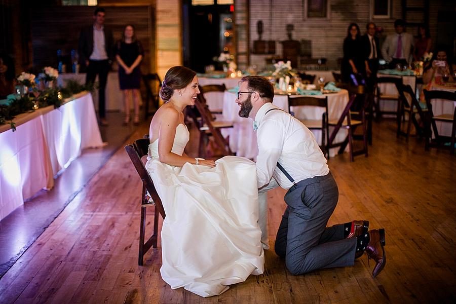 Getting the garter at this Fountain City Church Wedding by Knoxville Wedding Photographer, Amanda May Photos.