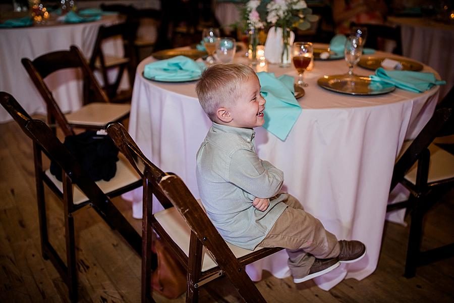 Sitting on a chair at this Fountain City Church Wedding by Knoxville Wedding Photographer, Amanda May Photos.