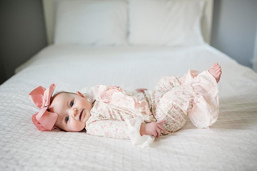 On the bed at this Studio 3 Month Session by Knoxville Wedding Photographer, Amanda May Photos.