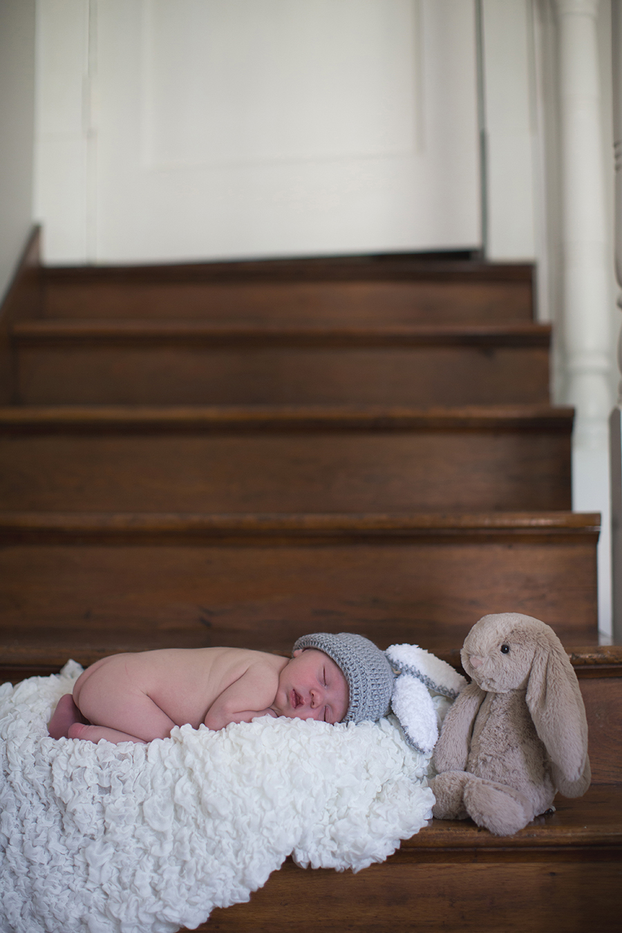 Laying on stairs at this Tullahoma, TN newborn session by Knoxville Wedding Photographer, Amanda May Photos.