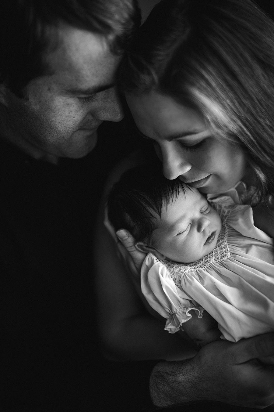 Mom, dad and baby at this Tullahoma, TN newborn session by Knoxville Wedding Photographer, Amanda May Photos.