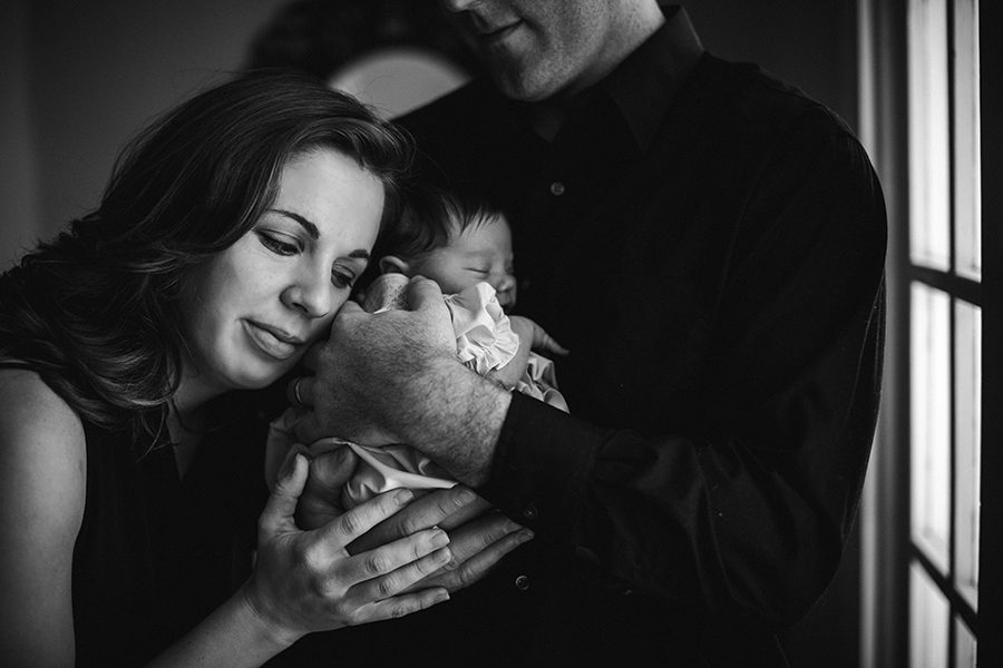 Her cheek against his hand at this Tullahoma, TN newborn session by Knoxville Wedding Photographer, Amanda May Photos.